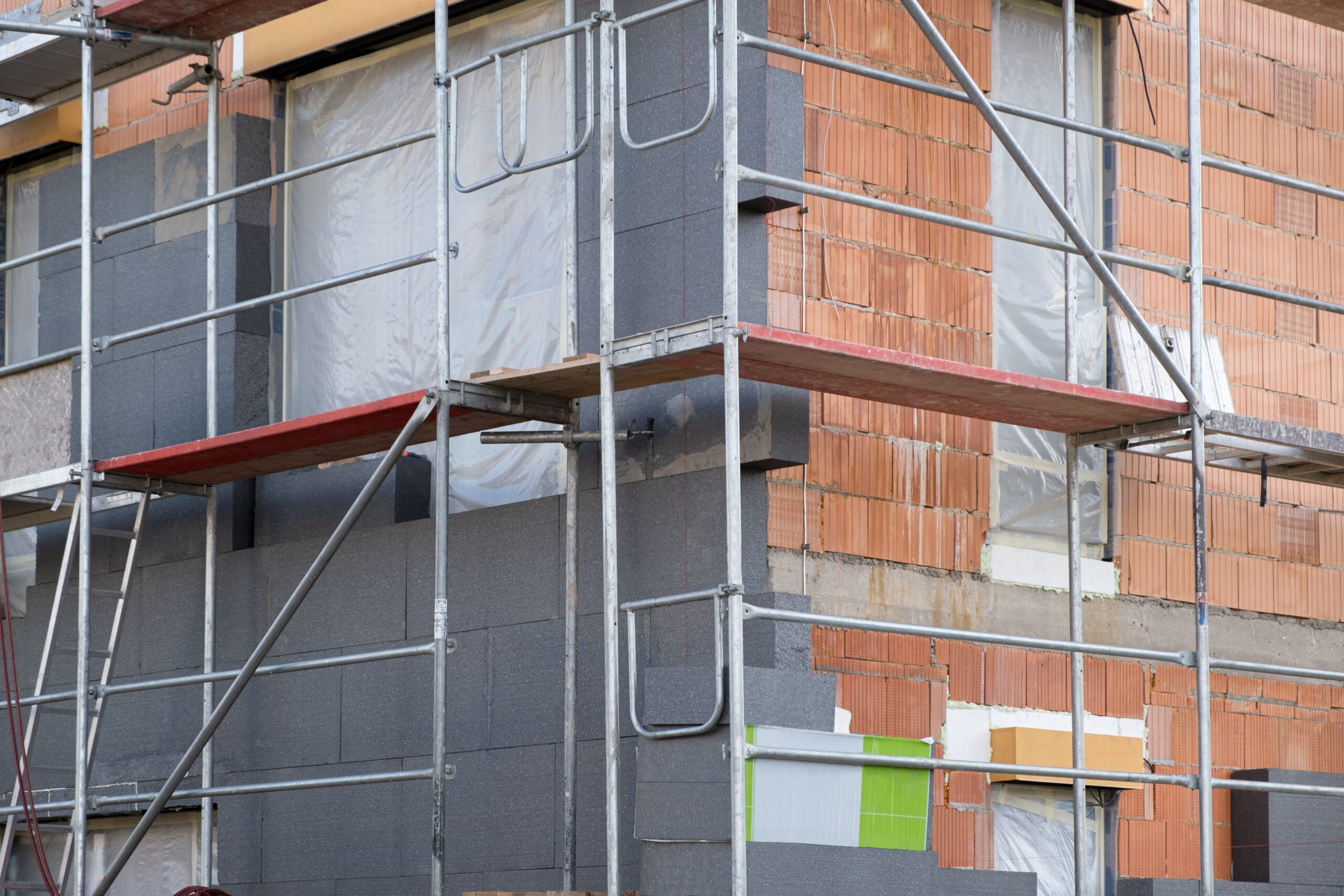 Expanded Polystyrene (EPS),Black thermoplastic foam material, modern thermal insulation materials. building New House in process insulation of the wall of the house with layers Exterior covering