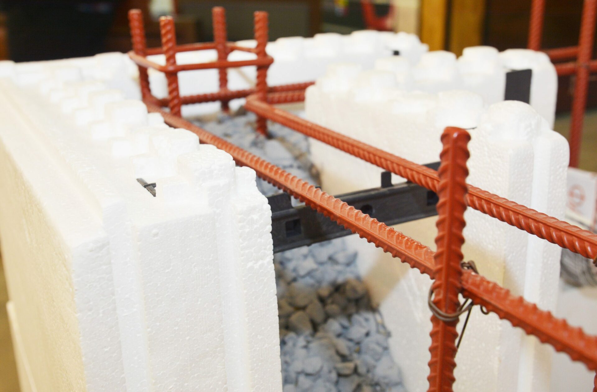 Insulating concrete forms ICF with reinforced concrete house walls. Insulating concrete forms ICF made of plastic foam